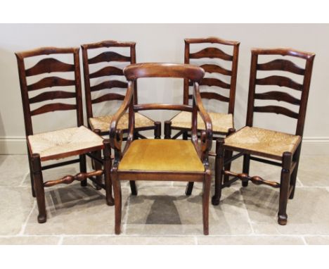 A matched set of four ash ladder back chairs, early 19th century, each with an envelope rush seat on turned front legs, talle