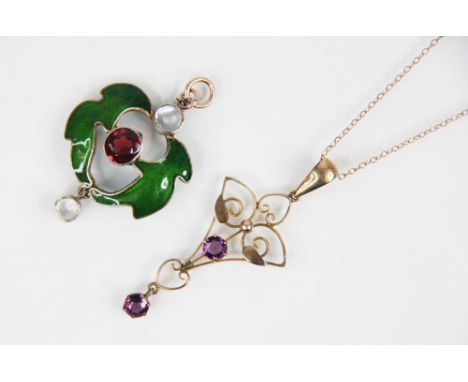 An Arts &amp; Crafts enamel, garnet and moonstone set pendant, 40mm long, together with an Edwardian yellow metal paste set o