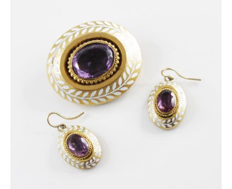 A Victorian paste and enamel brooch, the central mixed cut oval amethyst coloured paste measuring 18mm x 13mm, set to an unma