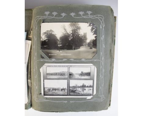 A collection of approximately 200 hundred postcards to a cloth bound album, comprising topographical, portrait, floral and hu