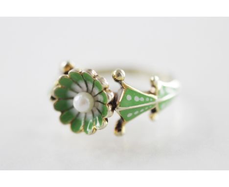 A 9ct gold enamel and pearl set dress ring, the central daisy shaped head set with a cultured pearl and decorated with green 