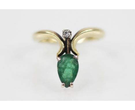 An emerald and diamond 18ct gold ring, comprising a pear-shaped emerald measuring 8mm x 5mm, and a brilliant cut diamond, all