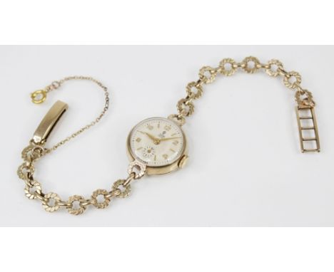 A lady's vintage 9ct gold Tudor wristwatch, the round cream dial with Arabic and baton markers and subsidiary dial to six 'o'