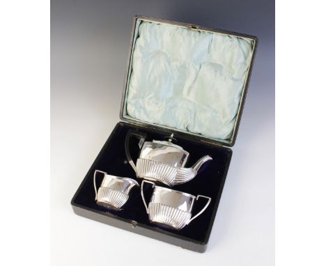 A Victorian three-piece bachelor's tea service, Walker &amp; Hall, Sheffield 1892-93, comprising teapot, milk jug and sucrier