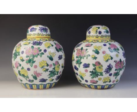 A pair of Chinese porcelain ginger jars and covers, 20th century, each of typical from, decorated in polychrome enamel with f