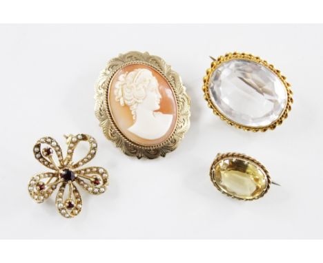 A 9ct gold mounted carved shell cameo brooch, depicting the profile of a lady set to an engraved 9ct gold border, hinged pin 