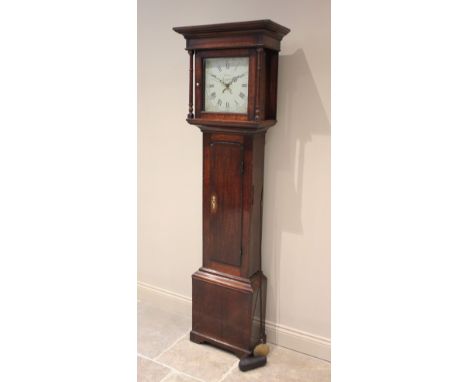 A George III oak cased thirty hour longcase clock signed W Jones, Llanfyllin, with a moulded cornice above a pair of freestan