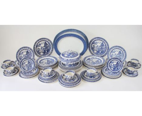 A Wedgwood part dinner service in the 'Willow' pattern, comprising: eight soup plates, twelve side plates, ten salad plates, 