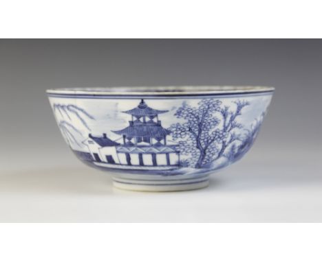 A Chinese porcelain blue and white bowl, Kangxi mark, 19th century, externally decorated with a Pagoda landscape, the interio