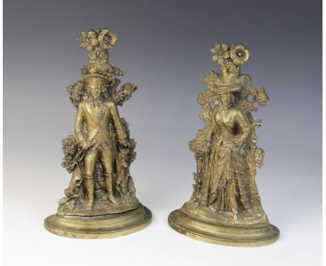 A pair of brass figural door porters, early 20th century, the first cast as a buccaneer with tricorn hat upon a stepped and i