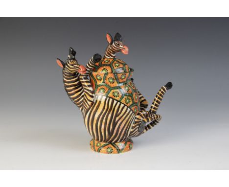 A South African Ardmore Studio pottery vessel and cover, the body modelled as zebra on its back with legs akimbo, wrapped aro