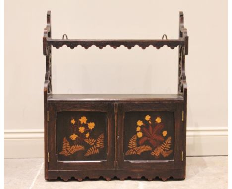 A Victorian Scottish Fernware oak wall cabinet, the single shelf with an arcaded frieze uniting scrolling open work supports,