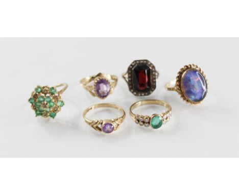 A selection of 9ct gold gemstone set dress rings, to include an emerald and diamond set ring, size L ½, an amethyst set ring,