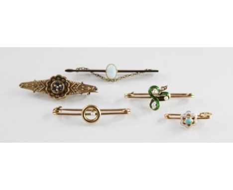 A selection of Victorian and later brooches, including an pearl and enamel clover set example (unmarked), 38mm wide, a turquo