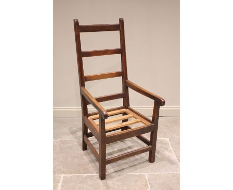 A West Country oak and ash ladder back armchair, late 19th century, of large proportions, the angled back with four rungs ext