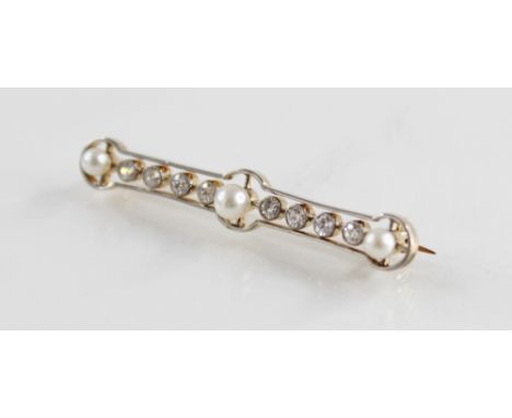 An Art Deco diamond and pearl set bar brooch, comprising three round cultured pearls and eight old cut diamonds, all set to a