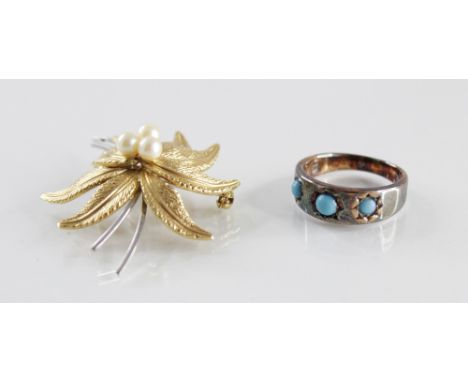 A turquoise set three-stone ring, comprising three turquoise cabochons measuring between 3mm and 4mm, claw set to a plain pol