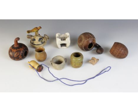 An East African Masai beaded ivory snuff bottle and a collection of South American items to include carved gourds, a water pi