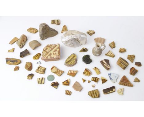 A box containing a collection of fragments of archaeological interest, to include a fragment of medieval tile 14th century, w