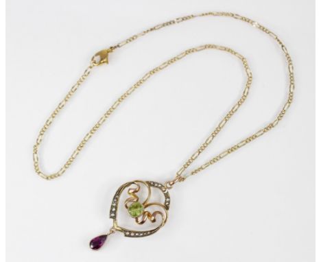 An Edwardian 9ct gold peridot, amethyst and seed pearl set pendant, the central mixed cut oval peridot measuring 6mm x 5mm, s
