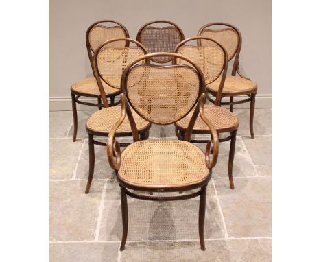 A matched set of six Thonet type bentwood chairs, early 20th century, each with a cordiform rattan back panel above a rattan 