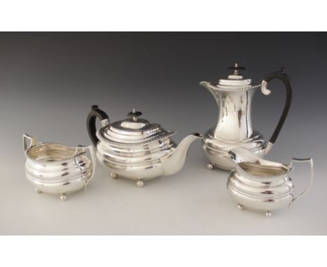 A George V four-piece silver tea service by William Hutton &amp; Sons, Sheffield 1926-28, comprising teapot, hot water jug, m