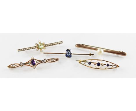 An Edwardian sapphire and pearl set 9ct gold brooch by Merrle Bennett &amp; Co, the pierced navette shaped brooch set with ro