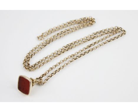 A 9ct gold belcher link chain, with spring ring and loop fastening, 80cm long, suspending a seal fob charm, the carnelian mat