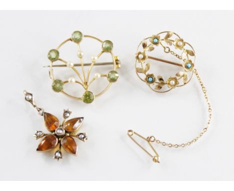 An Edwardian turquoise and seed pearl set garland brooch, hinged pin and simple loop fastening and safety chain, indistinctly