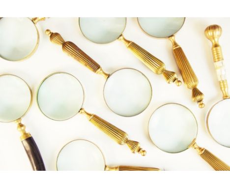 A collection of eleven magnifying glasses, 20th century, to include a horn handled example, two with glass handles, one with 