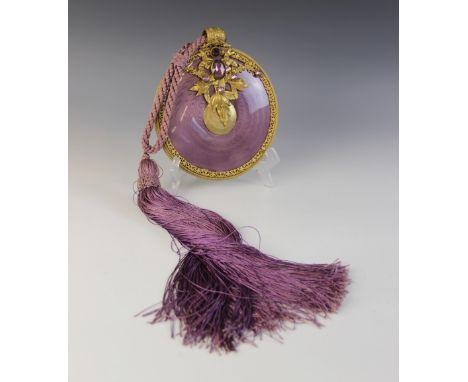 An enamelled hanging mirror, of circular form with purple guilloche enamel decoration, pierced foliate gold coloured mount se