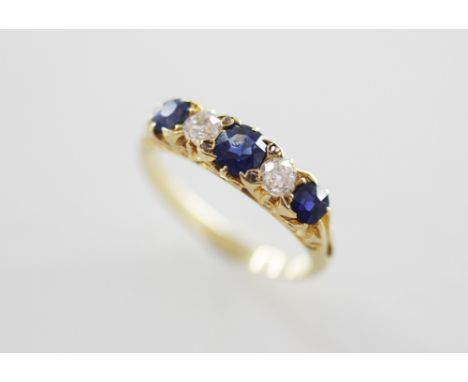 An early 20th century diamond and sapphire five-stone ring, comprising three mixed cut sapphires interspersed by two old cut 