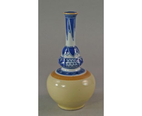 A Chinese bottle vase, in the Kangxi style, the neck with blue and white patterning, on yellow glazed bulbous body, signed to