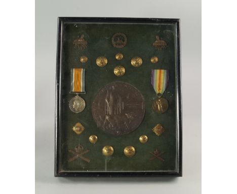 A World War circular bronze commemorative plaque for Second Lieutenant John Scott Huxley (1886-1916), of the Machine Gun Corp