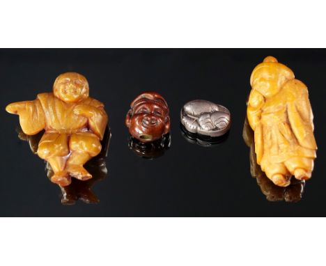 Two Japanese horn figural netsuke, late 19th/20th century, modelled as a crouching man and a man with a hand to his face, bot
