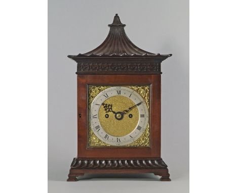 A George III and later mahogany Chinoiserie taste bracket clock, the top with fluted pagoda roof, above  banding of fret work