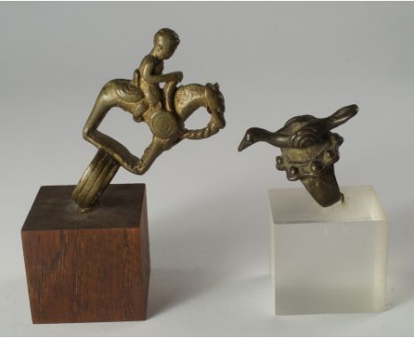After the antique, a bronze ring, mounted with an equestrian figure, together with a smaller ring with a bird mounted in a ne