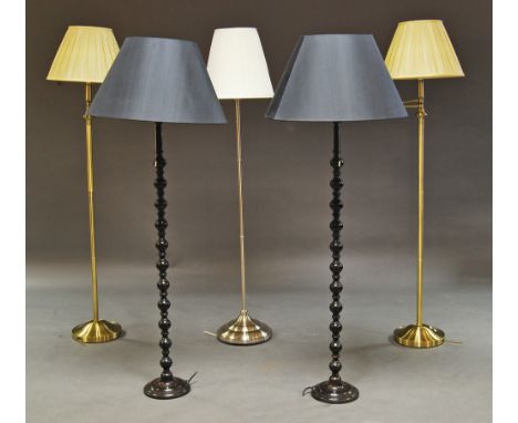 A pair of wooden standard lamps, 20th century, with bobbin turned shafts, 120cm high, together with a pair of brass standard 