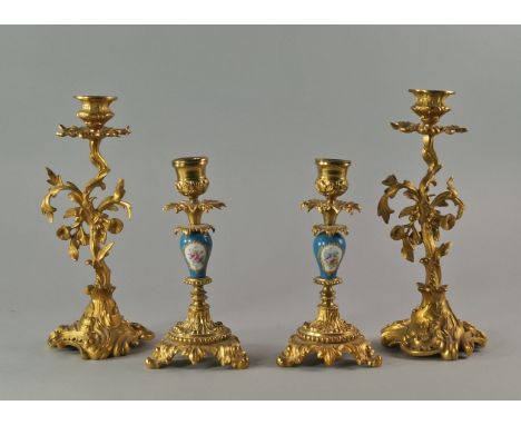 A pair of gilt metal and Sevres style candlesticks, 20th century, 18.5cm, together with a pair of single light candlesticks, 