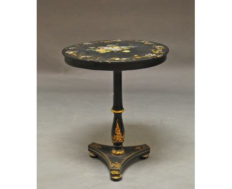 A Victorian papier machie lacquered and gilded circular table, painted and with mother of pearl inlay, on tripod base, 68cm h