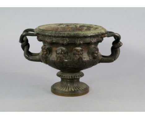 A bronze model of the Warwick vase, 19th century, 17cm high.  CONDITION REPORT: heavy wear, overall verdigris, otherwise good