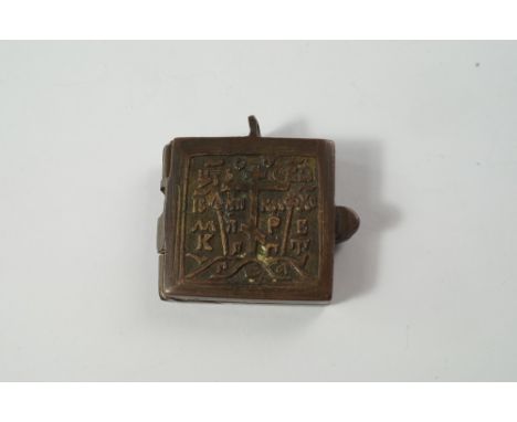 A Russian bronze and enamelled diptych travelling icon, late 19th/20th century, a moulded to the panels of the Saints, the ba