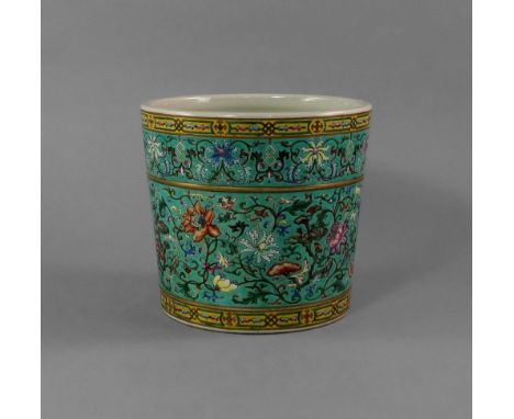 A Chinese porcelain cylindrical brush pot, 20th century, possibly Republican, decorated with two bands of styalised trailing 