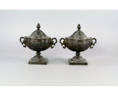 A pair of French bronze oval vases and covers, 19th century, overall moulded with foliate designs, 19cm high, (2).   CONDITIO