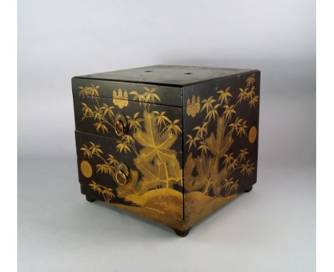 A Japanese lacquer and gilt box, with two drawers, late 19th century, on bracket feet, overall decorated with bamboo, pine an