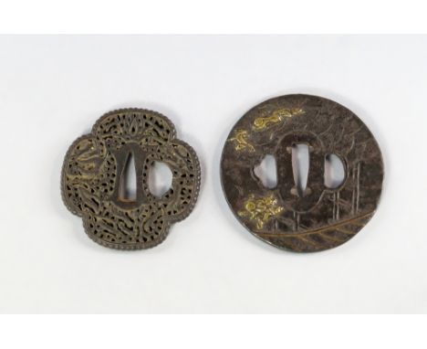 Two Japanese bronze tsuba, 18th/19th century, one of quatrefoil shape, pierced with stylised root designs, the other of large