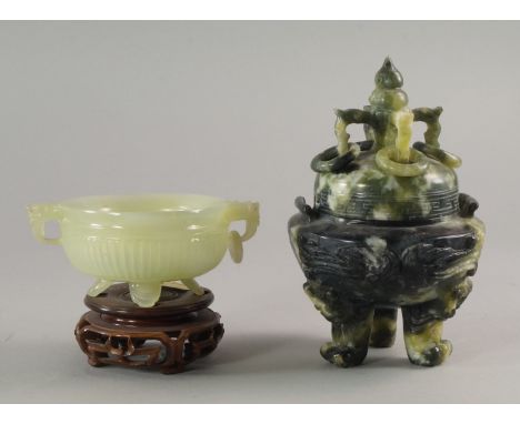 A Chinese green jadeite censor, 20th century, with lion carved handles, the body of ribbed reeded design, on tripod legs with