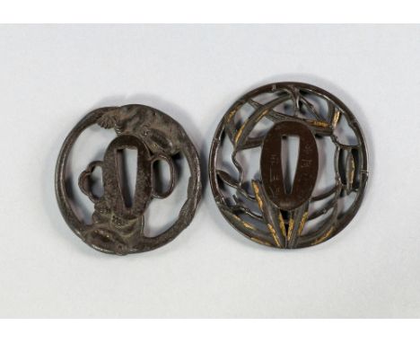 Two Japanese bronze tsuba, 19th century, of circular form, one pierced with bamboo leaves, signed, the other moulded with mon