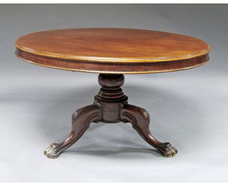 A Victorian mahogany centre table, 19th century, on turned pedestal support, carved tripod legs, paw feet, 68cm high x 118cm 