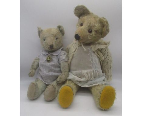 C.1920's teddy bear in blonde mohair, with glass eyes, jointed arms and legs, swivel head, stitched nose and mouth and replac